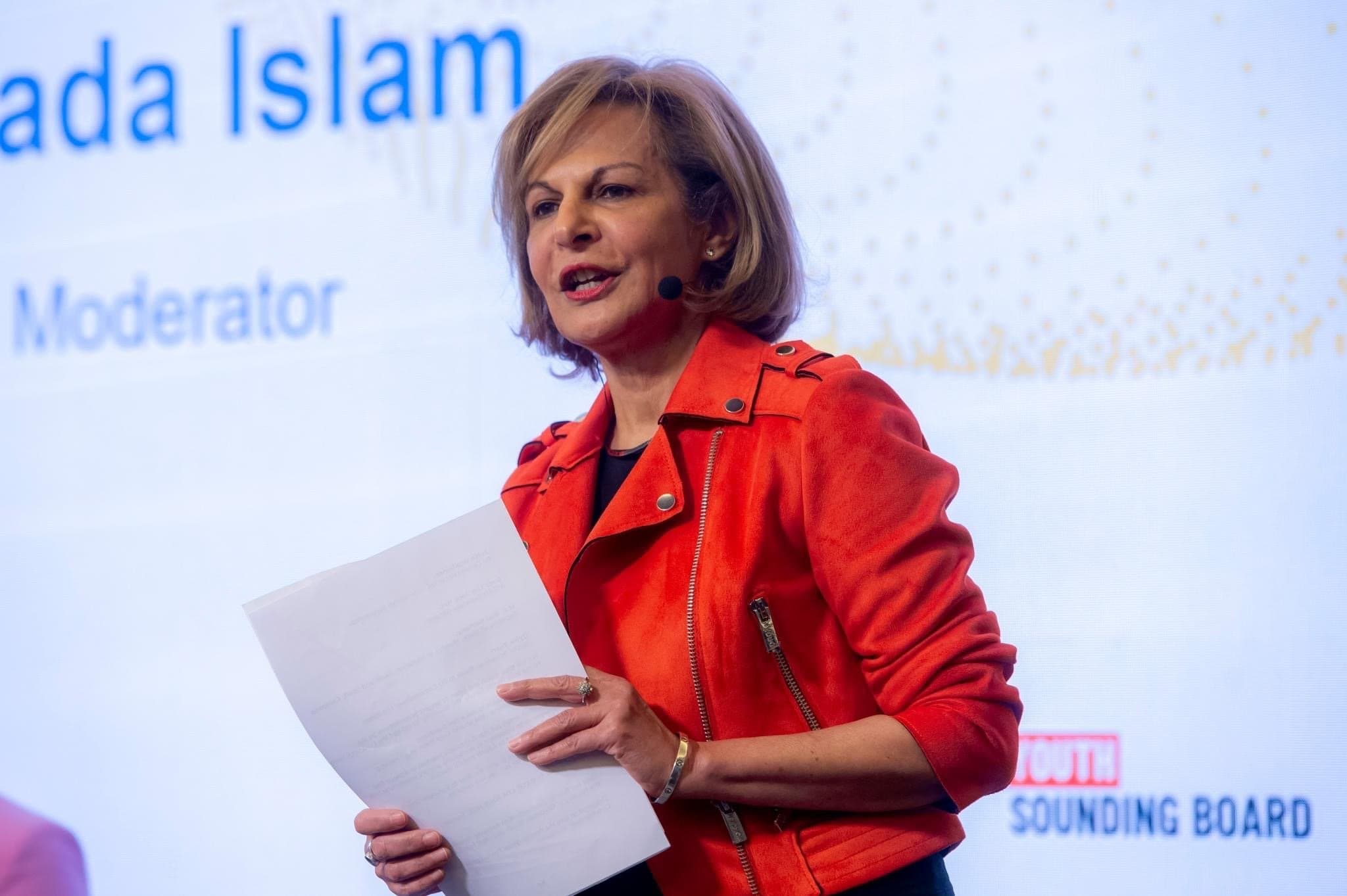 Shada speaking to crowd.